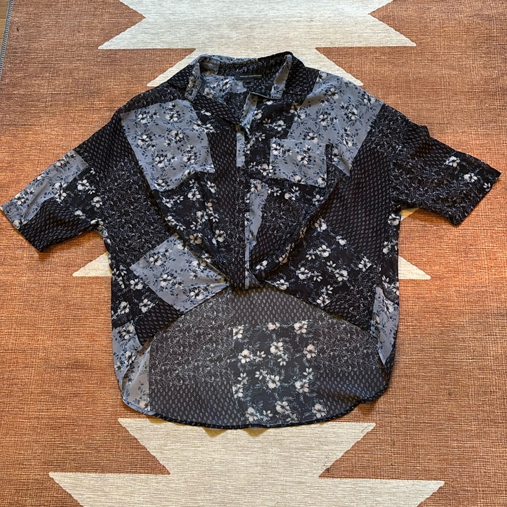 Small woman’s French Connection high/low flowy flowered Navy blouse